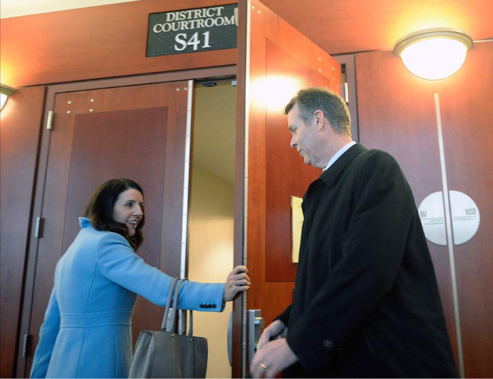 Al Hartmann  |  The Salt Lake Tribune
Defense lawyer Cara Tangaro opens  door to Judge Elizabeth Hruby-MIlls courtroom for 
John Swallow Tuesday Feb. 7 for the first day of jury selection in what is expected to be a several week trial.