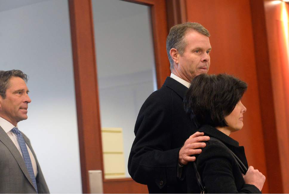 Al Hartmann  |  The Salt Lake Tribune
John Swallow and his wife Suzanne Seader enters Judge Elizabeth Hruby-MIlls courtroom in Salt Lake City Wednesday Feb. 8 for the first day of his public corruption trial .  His defense lawyer Scott Williams, behind.