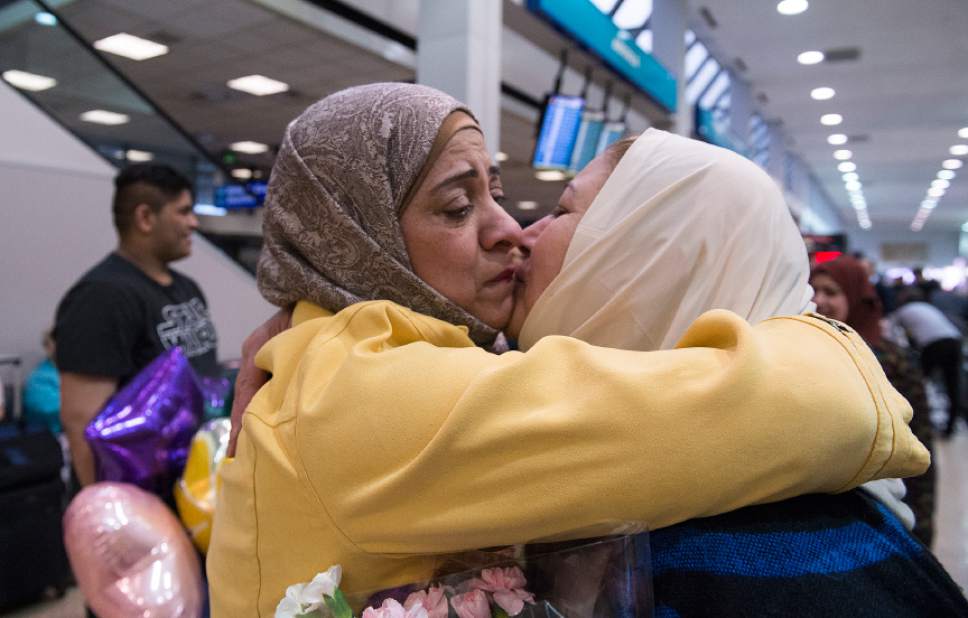 Leah Hogsten  |  The Salt Lake Tribune
Iman Alsaadi and her Iraqi sister-in-law, Nisreen Alsaadi exchange many kisses upon seeing each other for the first time in seven years at the Salt Lake International Airport, February 8, 2017. Nisreen Alsaadi and her son Zaid Alsaadi were allowed to come to the U.S. after a judge on Friday temporarily blocked President Donald Trump's ban on people from seven predominantly Muslim countries from entering the United States.