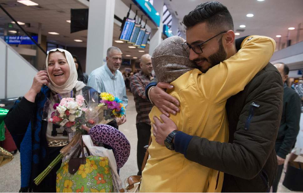 Leah Hogsten  |  The Salt Lake Tribune
l-r  Nisreen Alsaadi smiles as her sister-in-law, Iman Alsaadi hugs her son Zaid Alsaadi during their greeting for the first time in seven years at the Salt Lake International Airport, February 8, 2017. Nisreen Alsaadi and her son Zaid Alsaadi were allowed to come to the U.S. after a judge on Friday temporarily blocked President Donald Trump's ban on people from seven predominantly Muslim countries from entering the United States.