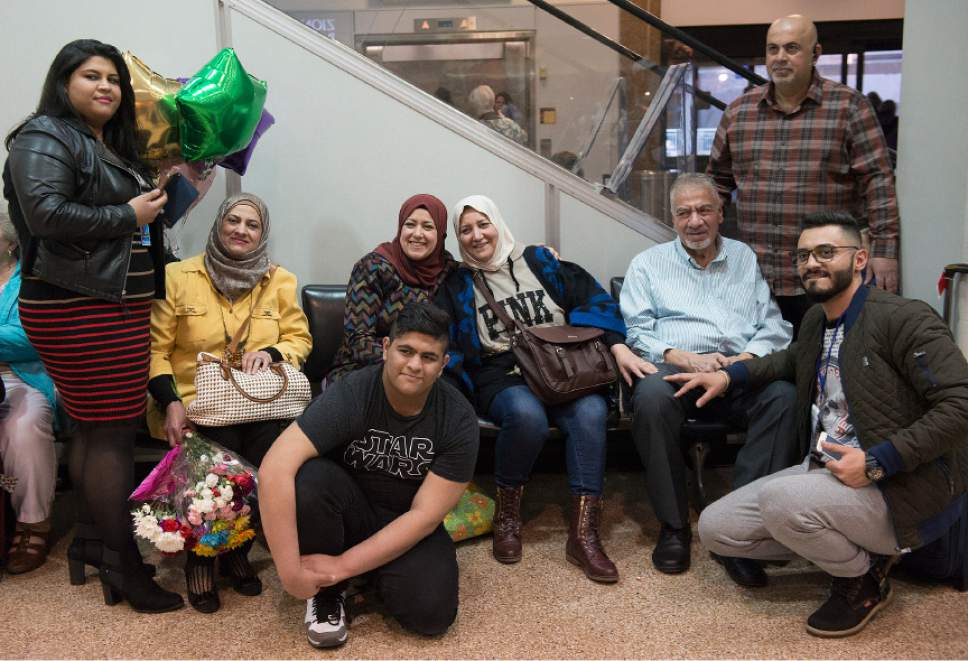 Leah Hogsten  |  The Salt Lake Tribune
l-r The Alsaadi family takes photographs of the arrival of Nisreen Alsaadi and her son Zaid Alsaadi at Salt Lake International Airport, February 8, 2017. The Alsaadi's were allowed to come to the U.S. after a judge on Friday temporarily blocked President Donald Trump's ban on people from seven predominantly Muslim countries from entering the United States.