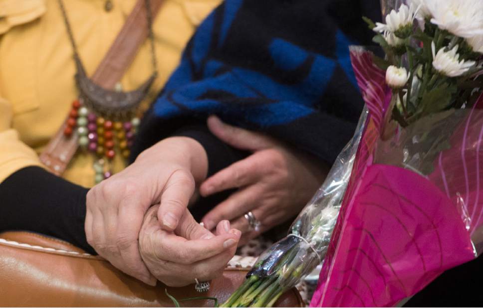 Leah Hogsten  |  The Salt Lake Tribune
Iman Alsaadi and her Iraqi sister-in-law, Nisreen Alsaadi hold hands upon seeing each other for the first time in seven years at the Salt Lake International Airport, February 8, 2017. Nisreen Alsaadi and her son Zaid Alsaadi were allowed to come to the U.S. after a judge on Friday temporarily blocked President Donald Trump's ban on people from seven predominantly Muslim countries from entering the United States.