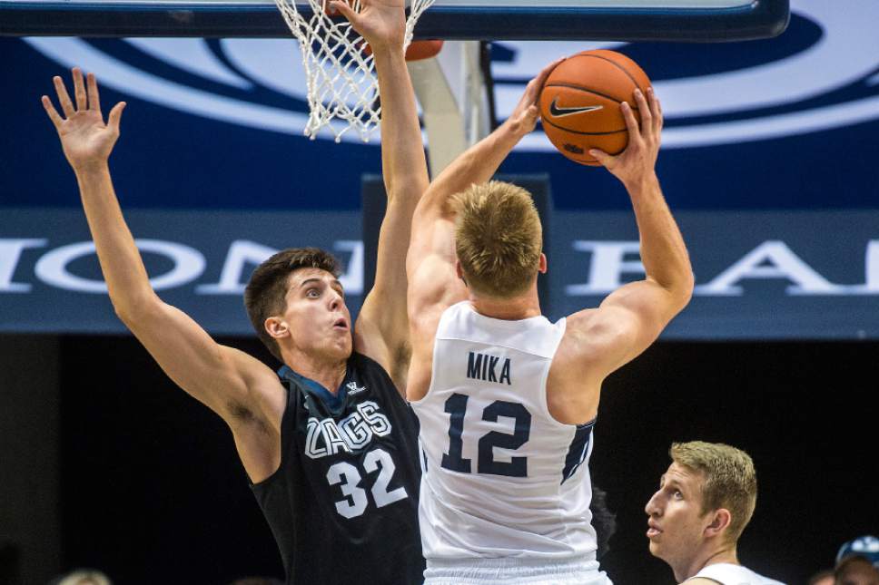 Chris Detrick  |  The Salt Lake Tribune
Brigham Young Cougars forward Eric Mika (12) shoots over Gonzaga Bulldogs forward Zach Collins (32) during the game at the Marriott Center Thursday February 2, 2017.