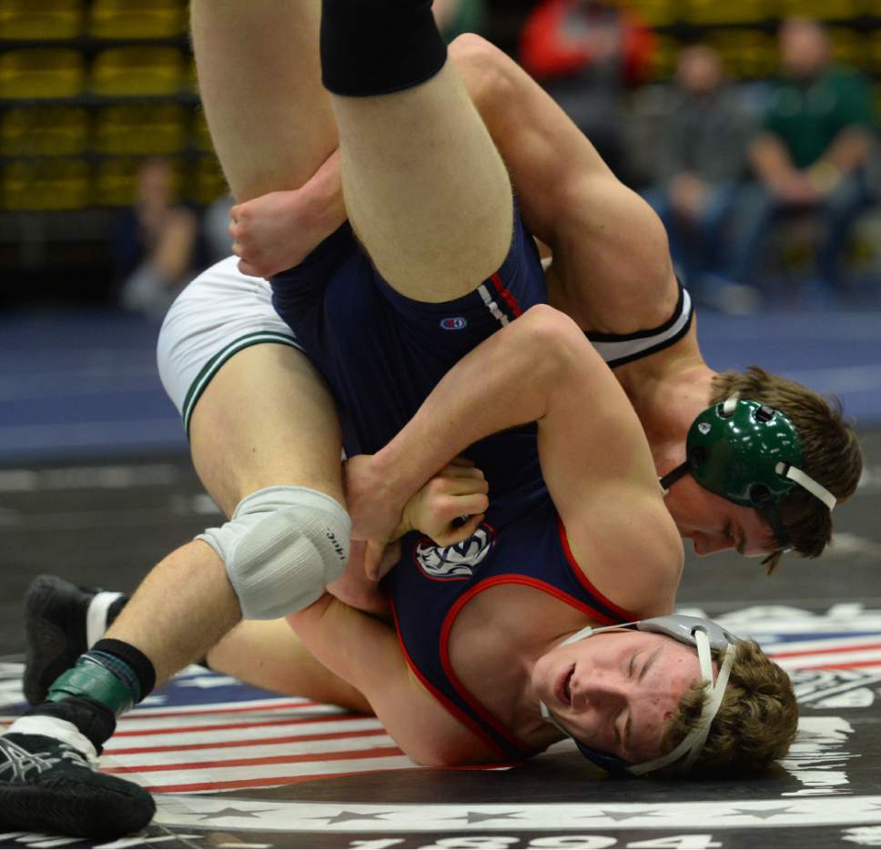 Steve Griffin  |  The Salt Lake Tribune

Payson's Wyatt Monroe drives Brandon Ehlers, of Woods Cross, into the mat during the 4A high school state wrestling tournament at UCCU Center out the Utah Valley University campus in Provo Wednesday February 8, 2017