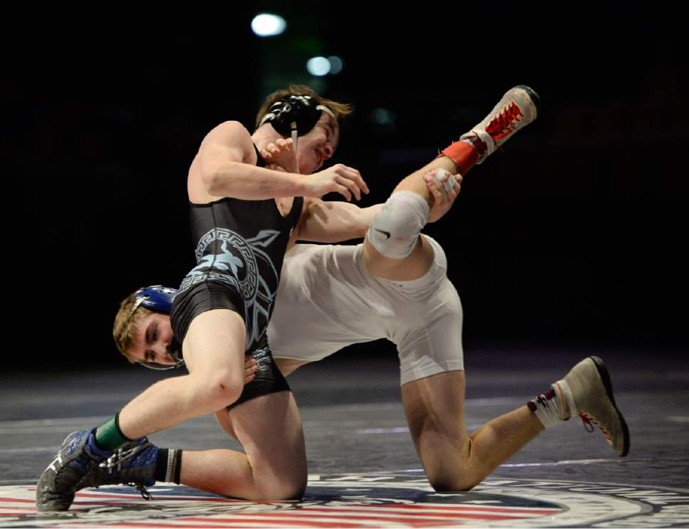 Francisco Kjolseth | The Salt Lake Tribune
Tyson Humpherys of Layton, foreground battles Tayton Bennett of Fremont for a win during the 5A 113 high school state wrestling tournament at UCCU Center on the Utah Valley University campus in Provo Thursday, February 9, 2017.