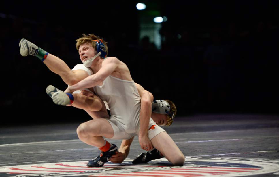 Francisco Kjolseth | The Salt Lake Tribune
Brayden Clark of Fremont, in back, wrestles Braydon Mogle of Mountain Crest during the 5A high school state wrestling tournament at UCCU Center on the Utah Valley University campus in Provo Thursday, February 9, 2017. Clark went on to win the 106 weight division.