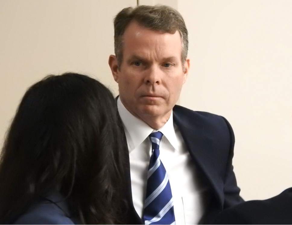 Rick Egan  |  The Salt Lake Tribune

John Swallow talks to Cara Tangaro from his defense team, during a recess in  his trial in Judge Elizabeth Hruby-Mills courtroom in Salt Lake City, Thursday, February 9, 2017.