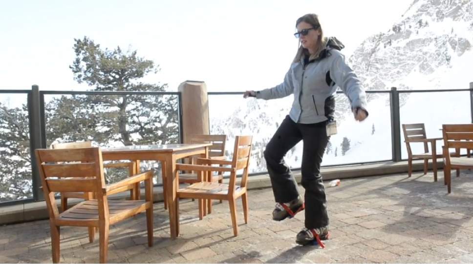 Rick Egan  |  The Salt Lake Tribune

Reporter Erin Alberty balances with the Skia Ski Trainer blocks strapped to her boots Jan. 18, 2017 on the patio of the John Paul Lodge at Snowbasin Resort.
