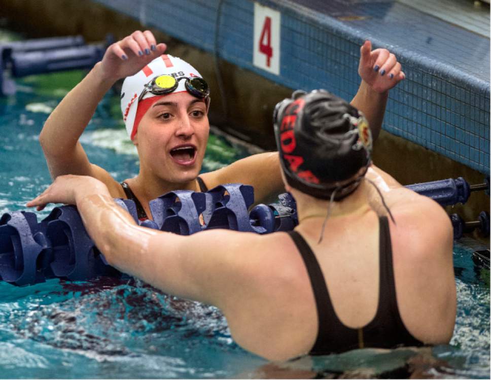 Steve Griffin  |  The Salt Lake Tribune


Rozie Selznick, left, reaches to hug Kristen Gross, of Cedar City, following the finish of the 50 free during the first day of the state 3A swimming championships at the BYU natatorium in Provo Friday February 10, 2017. Hess won the event. Selznick won the event.