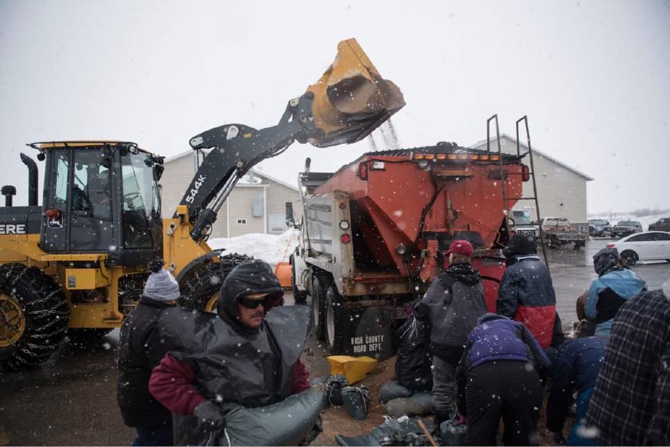 Lennie Mahler  |  The Salt Lake Tribune

Jason Mathews of the Garden City Fire Department dumps sand into a truck to be loaded into bags Garden City, Utah, Friday, Feb. 10, 2017.