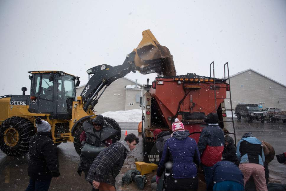Lennie Mahler  |  The Salt Lake Tribune

Jason Mathews of the Garden City Fire Department dumps sand into a truck to be loaded into bags Garden City, Utah, Friday, Feb. 10, 2017.
