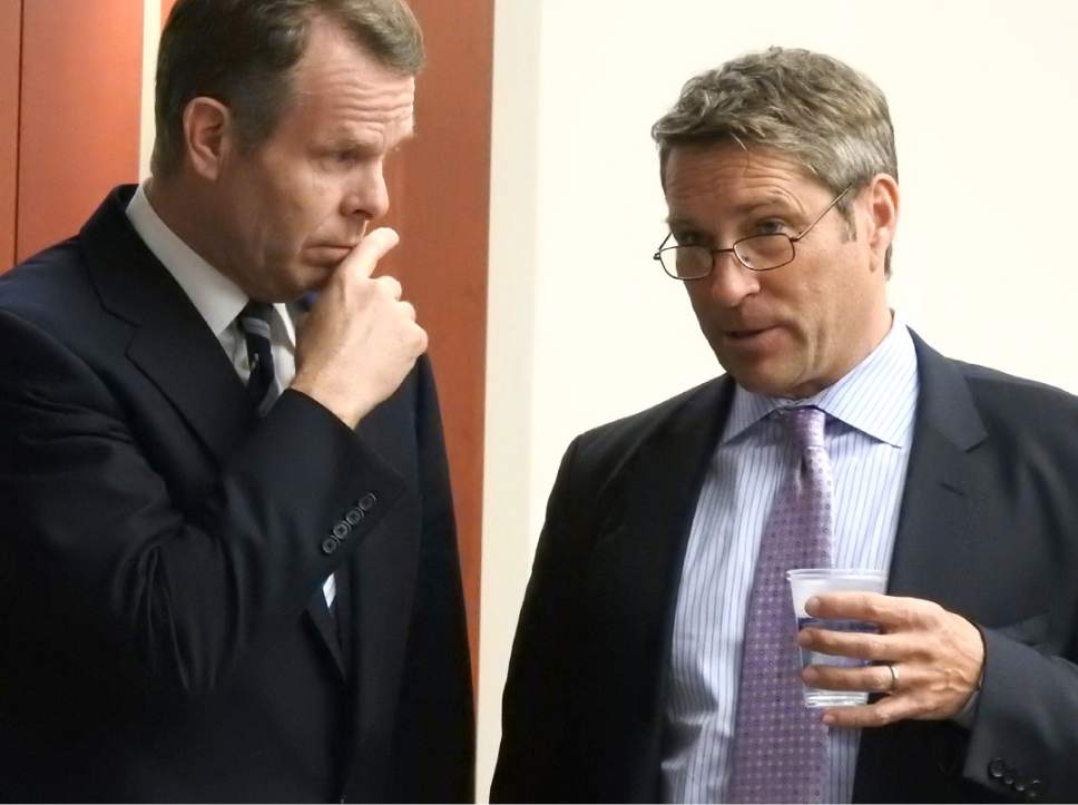 Rick Egan  |  The Salt Lake Tribune

John Swallow talks with Brad Anderson from his defense team, during a recess in  his trial in Judge Elizabeth Hruby-Mills courtroom in Salt Lake City, Thursday, February 9, 2017.