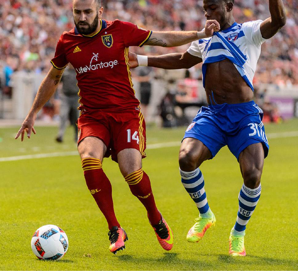 Trent Nelson  |  The Salt Lake Tribune
Real Salt Lake forward Yura Movsisyan (14) pushes off FC Dallas defender Maynor Figueroa (31) as Real Salt Lake faces FC Dallas at Rio Tinto Stadium in Sandy, Saturday August 20, 2016.