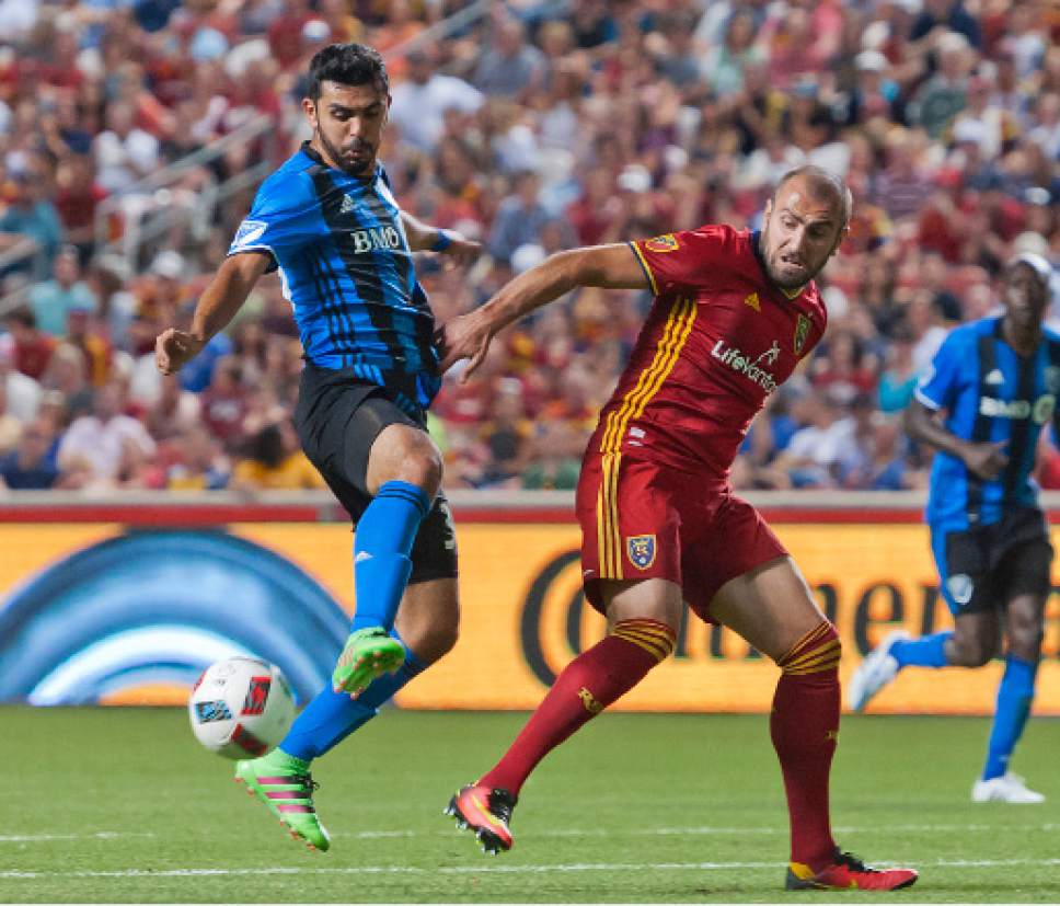 Michael Mangum  |  Special to the Tribune

Montreal Impact defender Victor Cabrera (36) intercepts a pass intended for Real Salt Lake forward Yura Movsisyan (14) at the edge of the 18-yard box during their MLS match at Rio Tinto Stadium in Sandy, UT on Saturday, July 9th, 2016. Montreal stymied RSL's attack and the match ended in a 1-1 draw.