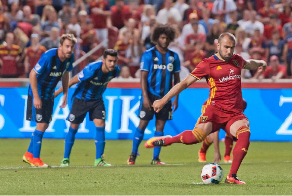 Michael Mangum  |  Special to the Tribune

Real Salt Lake forward Yura Movsisyan (14) takes a penalty kick during the second half of their MLS match against the Montreal Impact at Rio Tinto Stadium in Sandy, UT on Saturday, July 9th, 2016. Movsisyan scored with the kick and the match ended in a 1-1 draw.