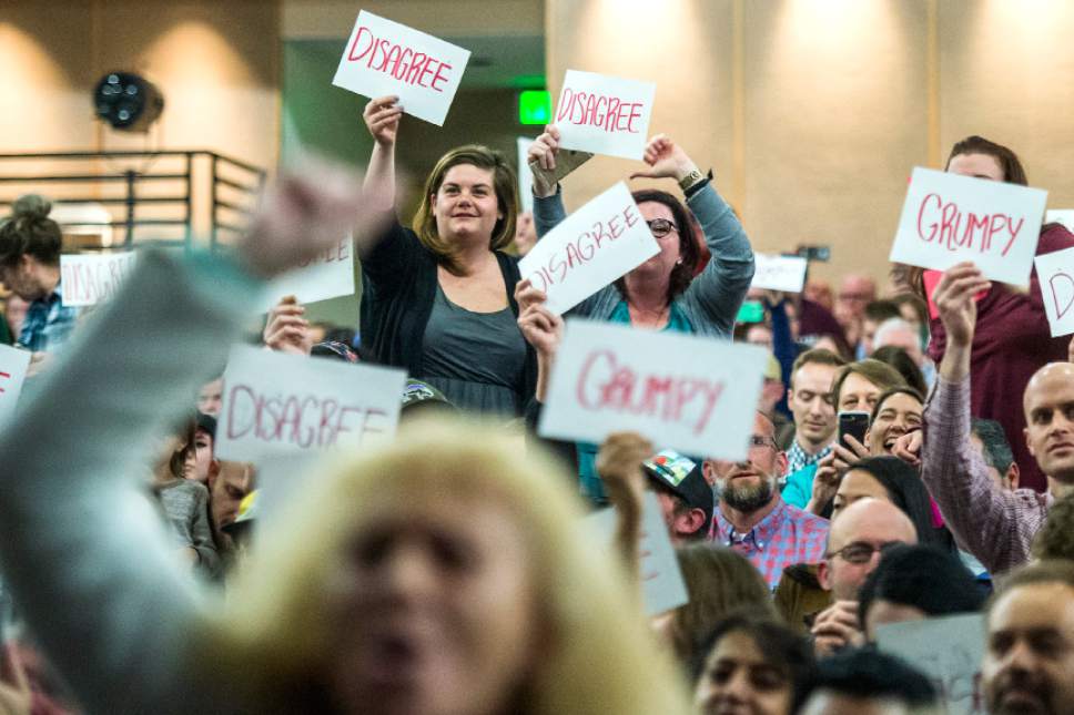 Chris Detrick  |  The Salt Lake Tribune
Members of the audience hold up signs as U.S. Rep. Jason Chaffetz, R-Utah, speaks during the town-hall meeting in Brighton High School Thursday February 9, 2017.