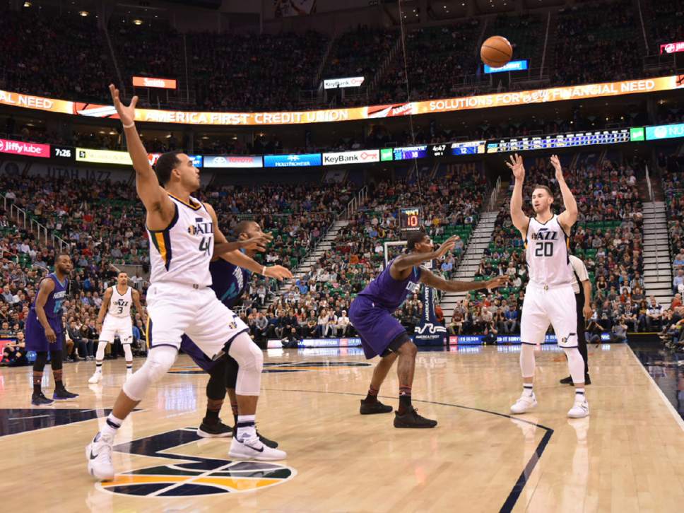 Lennie Mahler  |  The Salt Lake Tribune

Gordon Hayward makes an entry pass to Trey Lyles in a game against the Charlotte Hornets at Vivint Smart Home Arena on Saturday, Feb. 4, 2017.