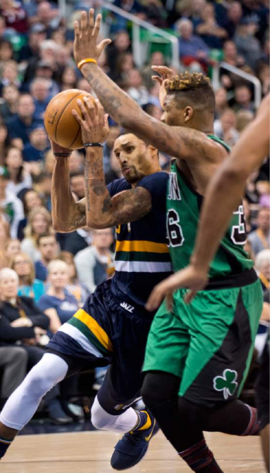 Lennie Mahler  |  The Salt Lake Tribune

George Hill drives around Boston's Marcus Smart in the first half of a game between the Utah Jazz and the Boston Celtics at Vivint Smart Home Arena on Saturday, Feb. 11, 2017.
