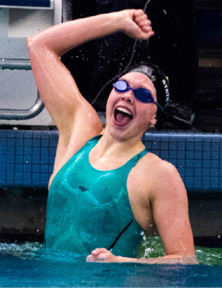 Rick Egan  |  The Salt Lake Tribune

Malay Cazier, Maple Mountain, celebrates her first place finish in the Womens 100 Yard Backstroke, in the 4A state swimming finals at BYU, Saturday, February 11, 2017.
