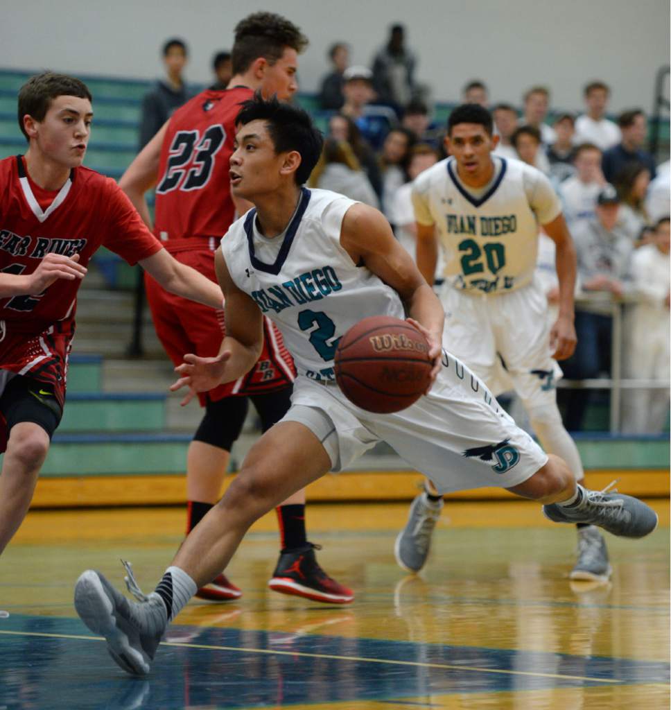 Steve Griffin / The Salt Lake Tribune

 Juan Diego's Eslliely Tan takes a giant step as he gets into the lane during game against  Bear River at Juan Diego Catholic High School in Draper Wednesday January 11, 2017.