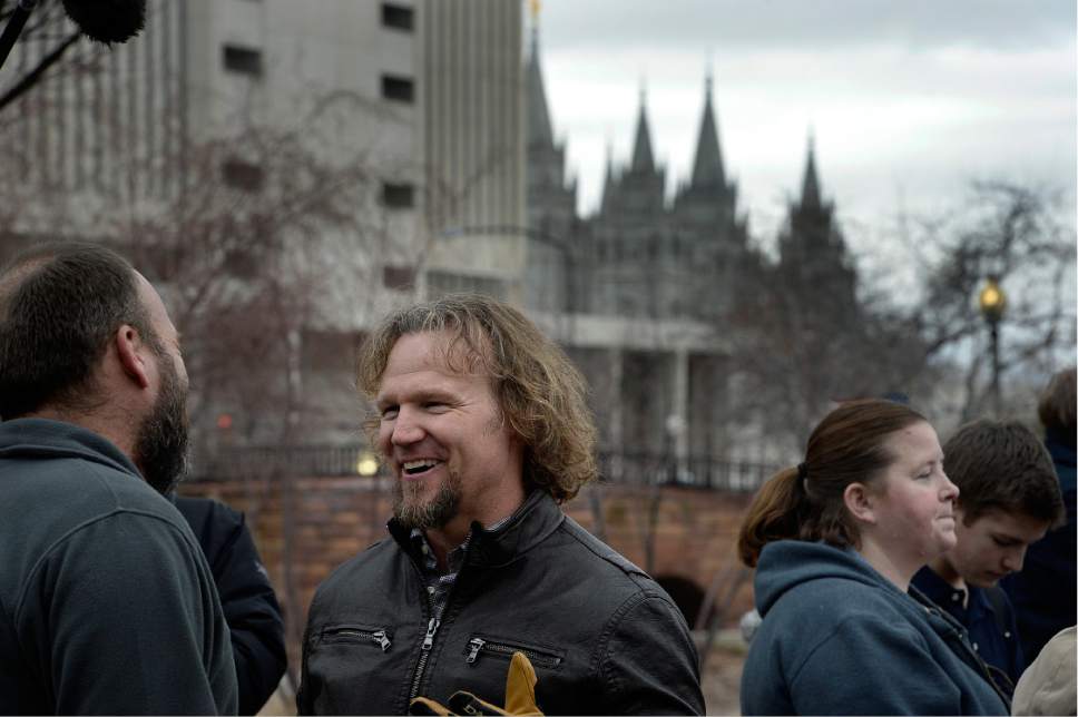 Scott Sommerdorf   |  The Salt Lake Tribune  
Polygamist Kody Brown and his family marched across State Street near the LDS Office Building in order to meet up with other polygamists and supporters prior to marching to the Capitol where they held a rally, Friday, Feb. 10, 2017.