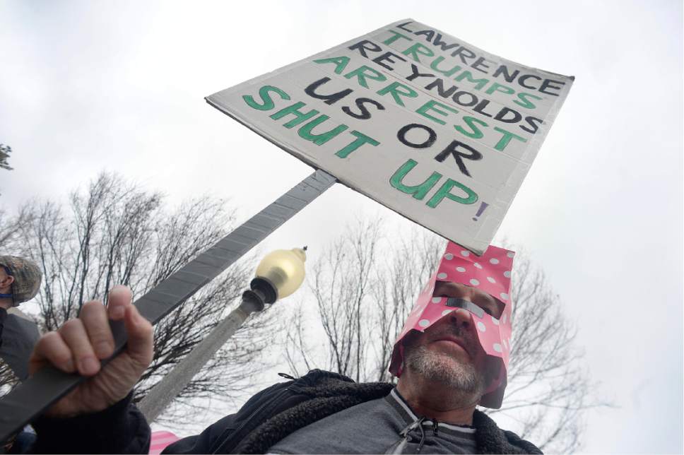Scott Sommerdorf   |  The Salt Lake Tribune  
A man looking to protect his identity gathered with polygamists and their supporters at City Creek Park and marched then marched to the Capitol where they held a rally, Friday, February 10, 2017.