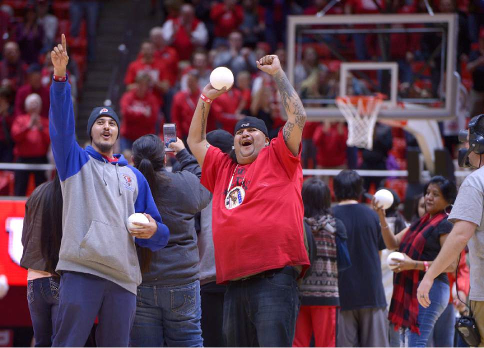 Leah Hogsten  |  The Salt Lake Tribune
Members of the Ute Indian Tribe threw balls into the crowd during a timeout in the first half. University of Utah's men's basketball team defeated University of Washington, 85-61 during their game, February 11, 2017 at Utah's Jon M. Huntsman Center.