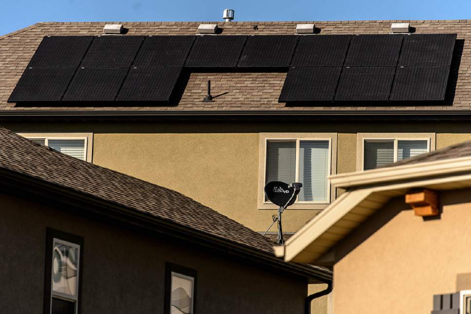 Trent Nelson  |  The Salt Lake Tribune
Solar panels are installed on the roof of a Farmington home. Based on the first quarter, Utah is on track to have more rooftop solar installed in 2016 than in all previous years combined. Adopters say that's because, in the last few months, it has become possible to replace your entire power bill with solar panels Û and with state and federal tax credits in place for at least the next year, it still is possible to get the government to refund you almost half the cost.