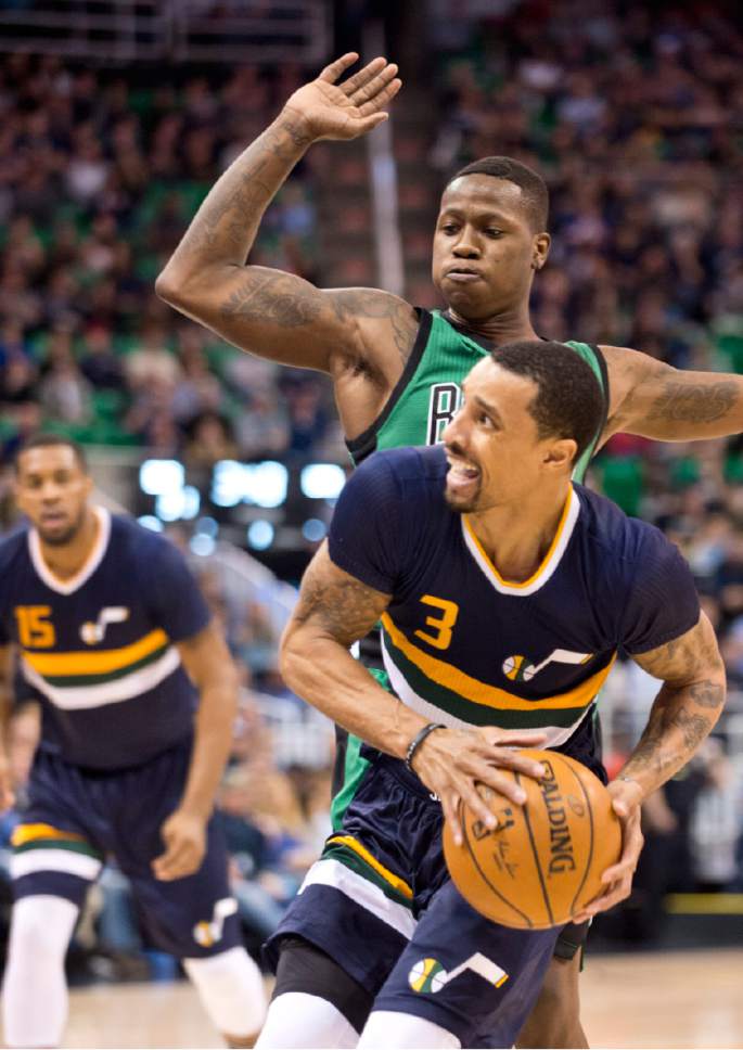 Lennie Mahler  |  The Salt Lake Tribune

George Hill drives around Boston's Terry Rozier in the first half of a game between the Utah Jazz and the Boston Celtics at Vivint Smart Home Arena on Saturday, Feb. 11, 2017.