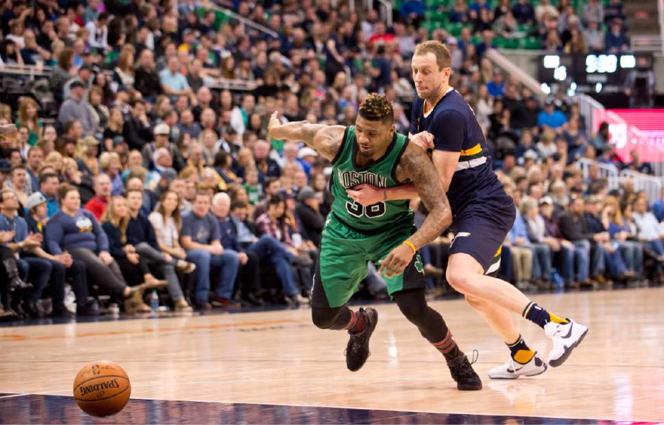 Lennie Mahler  |  The Salt Lake Tribune

Joe Ingles knocks the ball away from Boston's Marcus Smart in the first half of a game between the Utah Jazz and the Boston Celtics at Vivint Smart Home Arena on Saturday, Feb. 11, 2017.