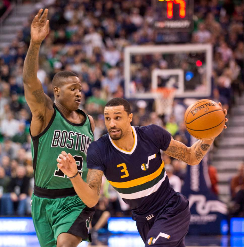 Lennie Mahler  |  The Salt Lake Tribune

George Hill drives around Boston's Terry Rozier in the first half of a game between the Utah Jazz and the Boston Celtics at Vivint Smart Home Arena on Saturday, Feb. 11, 2017.