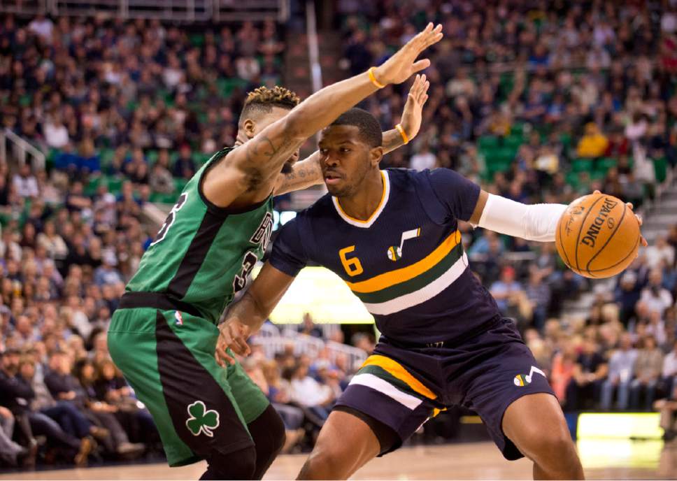 Lennie Mahler  |  The Salt Lake Tribune

Joe Johnson drives around Boston's Marcus Smart in the first half of a game between the Utah Jazz and the Boston Celtics at Vivint Smart Home Arena on Saturday, Feb. 11, 2017.