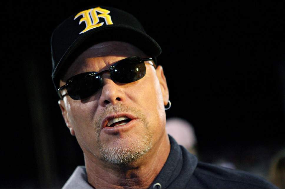 |  Tribune File Photo

Roy High School plays Box Elder High School at Roy, Utah, on Friday, Sept. 16, 2011. Former Roy football player Jim McMahon talks to the media after his number was retired during half time. McMahon went on to play in the NFL.