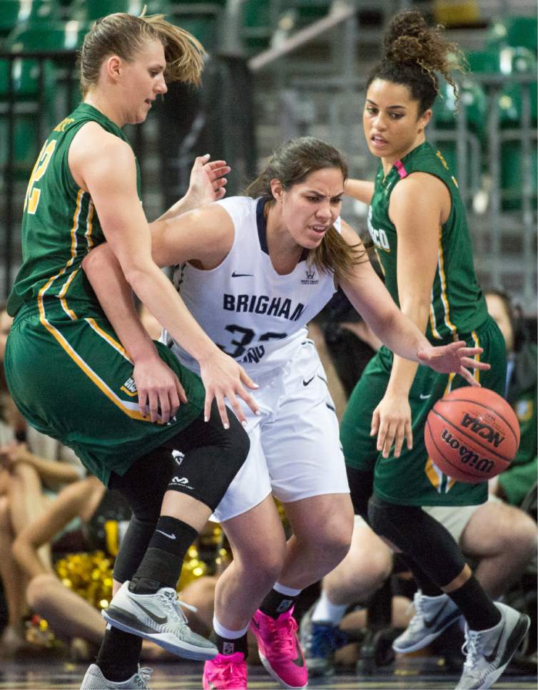 Rick Egan  |  The Salt Lake Tribune

Brigham Young Cougars forward Kalani Purcell (32) tries to get the ball down court as San Francisco Lady Dons forward Taylor Proctor (32)uses her knee to stop her, in the West Coast Conference Championship game, at the Orleans Arena in Las Vegas, Tuesday, March 8, 2016.