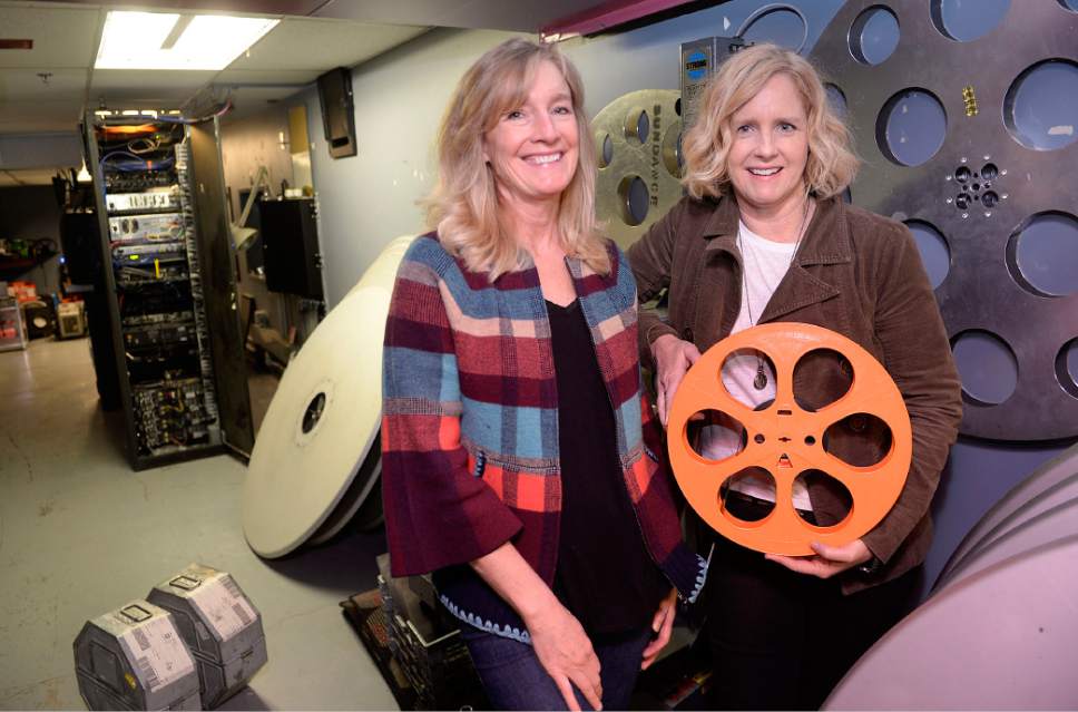 Al Hartmann  |  The Salt Lake Tribune 
Sarah Pearce, Sundance Institute managing director, left, and her sister Virginia Pearce, head of the Utah Film Commission,  pose for a picture in the projection room at the Broadway Centre Cinemas in Salt Lake City.  They work side by side in the small, close knit industry of Utah filmmaking.