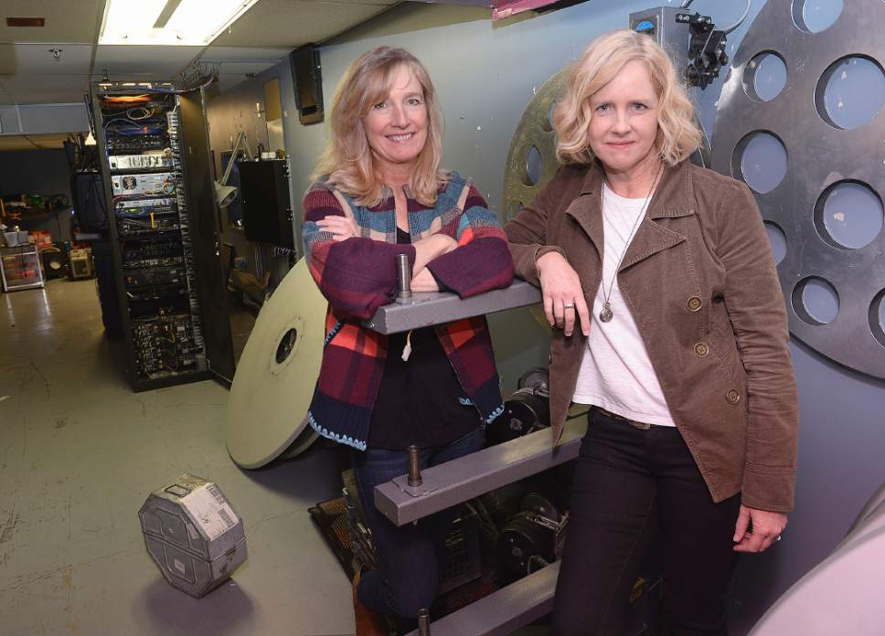 Al Hartmann  |  The Salt Lake Tribune 
Sarah Pearce, Sundance Institute managing director, left, and her sister Virginia Pearce, head of the Utah Film Commission,  pose for a picture in the projection room at the Broadway Centre Cinemas in Salt Lake City.  They work side by side in the small, close knit industry of Utah filmmaking.