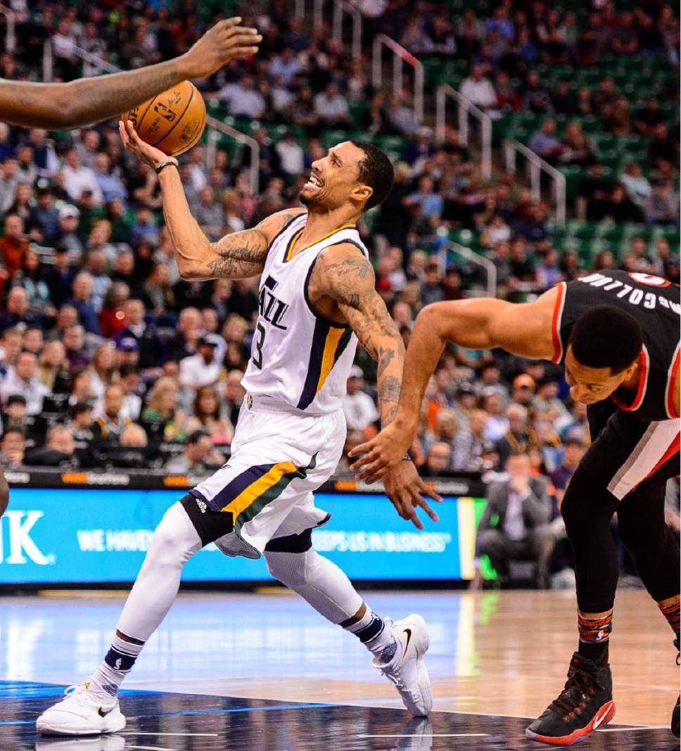 Trent Nelson  |  The Salt Lake Tribune
Utah Jazz guard George Hill (3) goes to the basket, tangled up with Portland Trail Blazers guard C.J. McCollum (3) as the Utah Jazz host the Portland Trailblazers, NBA basketball in Salt Lake City, Wednesday February 15, 2017.