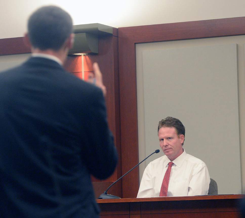 Al Hartmann  |  The Salt Lake Tribune
Prosecuter Fred Burmeister questions Jeremy Johnson in John Swallow's public corruption trial in Salt Lake City Wenesday Feb. 15. He takes the the 5th amendment and declines to testify. He was placed in contempt of court.