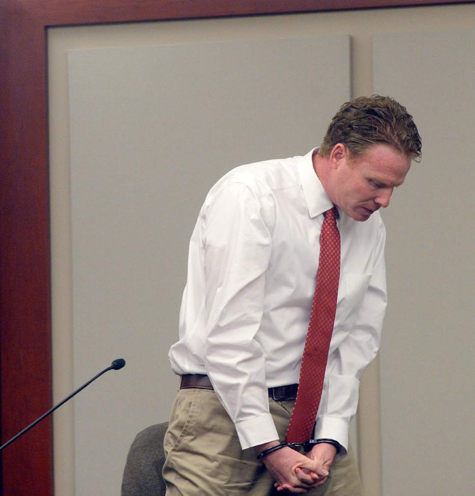 Al Hartmann  |  The Salt Lake Tribune
Jeremy Johnson takes the 5th amendment and declines to testify in John Swallow's public corruption trial in Salt Lake City Wednesday Feb. 15.  He was placed in contempt of court.  He leaves the witness stand still in handcuffs.