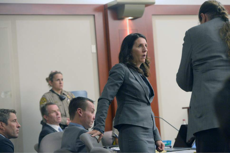 Al Hartmann  |  The Salt Lake Tribune
Defense lawyer Cara Tangaro, center, speaks with Mary Corporon, right, lawyer for Jeremy Johnson in John Swallow's public corruption trial in Salt Lake City Wed. Feb. 15. Corporon said that her client Jeremy Johnson wanted immunity before he will testify.