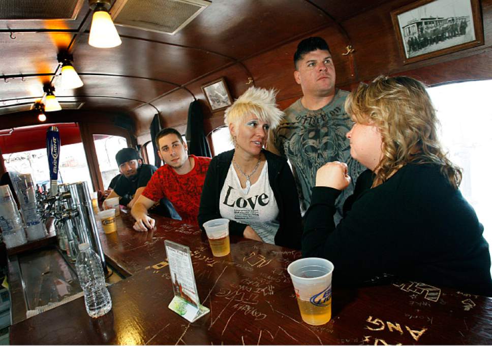 Scott Sommerdorf  |  Salt Lake Tribune

Bar regulars (left to right)l Chris Kent, John Keane, Debbie Brower, Travis Brower and Sheri Faircloth hang out at the Trolley Wing Company during the last hours of its operation in 2010.