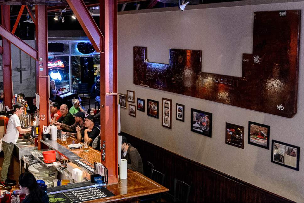 Trent Nelson  |  The Salt Lake Tribune
The bar from the previous location (in a trolley car) hangs on the wall at Trolley Wing Co.