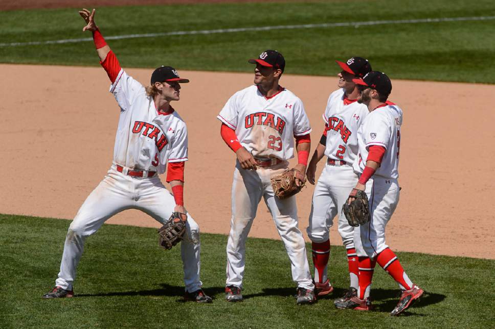 Trent Nelson  |  The Salt Lake Tribune
Utah players celebrate their 12-8 win over Washington, NCAA baseball, in a series for the Pac-12 title at Smith's Ballpark in Salt Lake City, Saturday May 28, 2016. From left, Hunter Simmons (9), Dallas Carroll (23), Kyle Hoffman (2), Kody Davis (3).