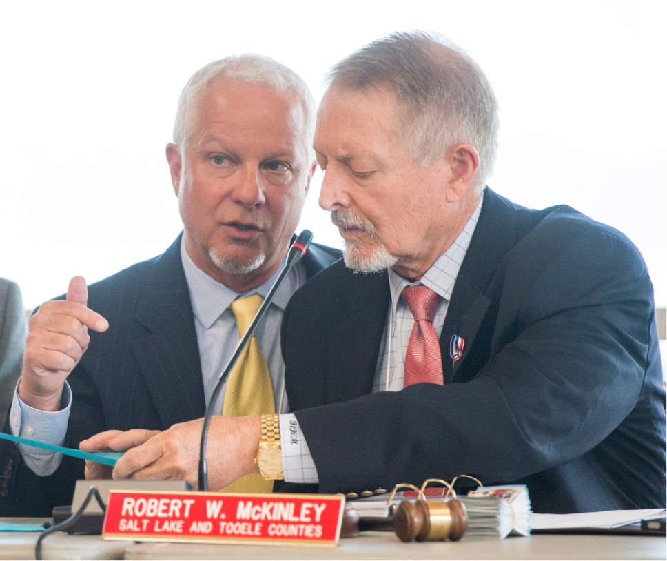 Rick Egan  |  Tribune file photo

UTA CEO Jerry Benson, left, chats with Board Chairman Robert W. McKinley at a Utah Transit Authority Board meeting earlier this year.