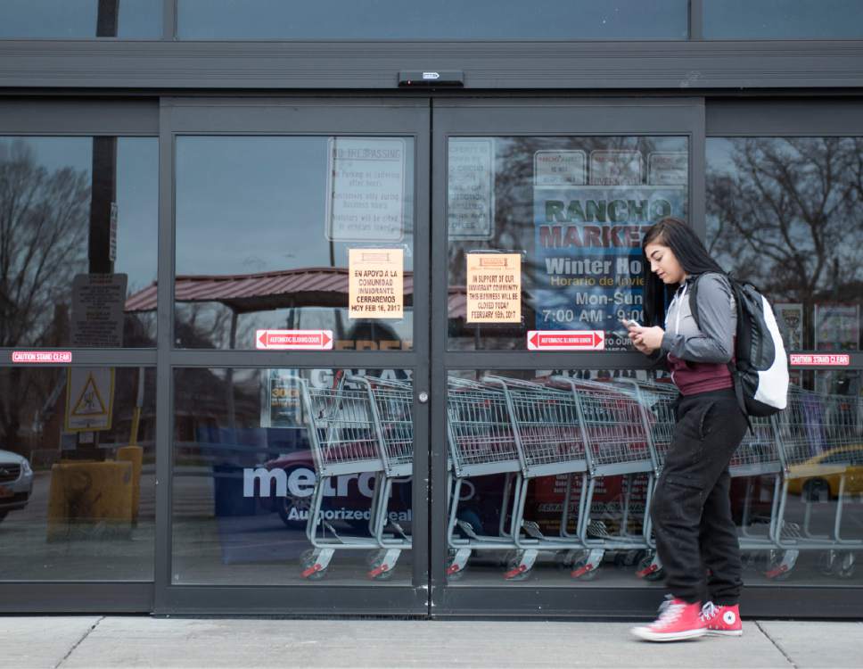 Lennie Mahler  |  The Salt Lake Tribune

Brooklyn Greco waits for a friend outside Rancho Markets in Salt Lake City, one of many businesses in Utah and around the country that closed Feb. 16 for the "A Day Without Immigrants" strike to support immigrants and emphasize their contributions to workplaces and society.