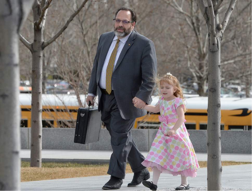 Scott Sommerdorf   |  The Salt Lake Tribune  
Real estate investment guru Rick Koerber arrives with his family to Federal Courthouse in Salt Lake City for his initial appearance on a new indictment for allegedly operating a $100 million Ponzi scheme on Thursday.