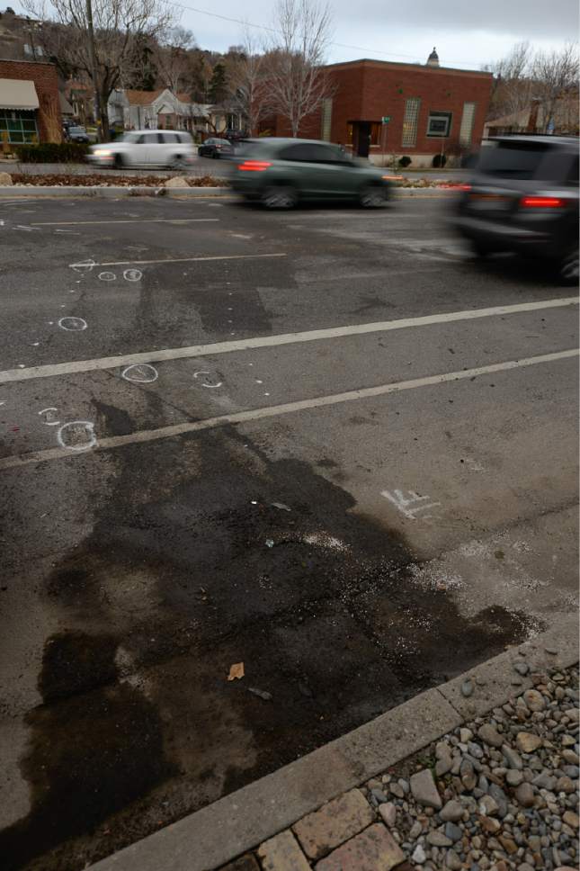 Francisco Kjolseth | The Salt Lake Tribune
Skid marks, car oil and investigation paint mark the scene of a deadly accident along 300 West and 700 North in Salt Lake on Thursday, Feb. 16, 2017. Two West High School seniors were killed and two others - another student, and a pregnant woman were seriously injured in a Thursday morning head-on collision north of the school.
