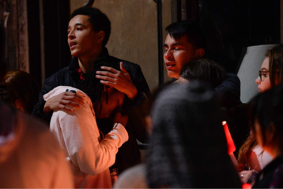 Francisco Kjolseth | The Salt Lake Tribune
West High School student MJ Powell, 18, upper left, comforts a friend as he says a few words after organizing a candlelight vigil at the scene of a deadly car accident involving students from the school early Thursday morning. Two West High School seniors were killed and two others - another student and a pregnant woman were seriously injured in the head-on collision north of the school.
