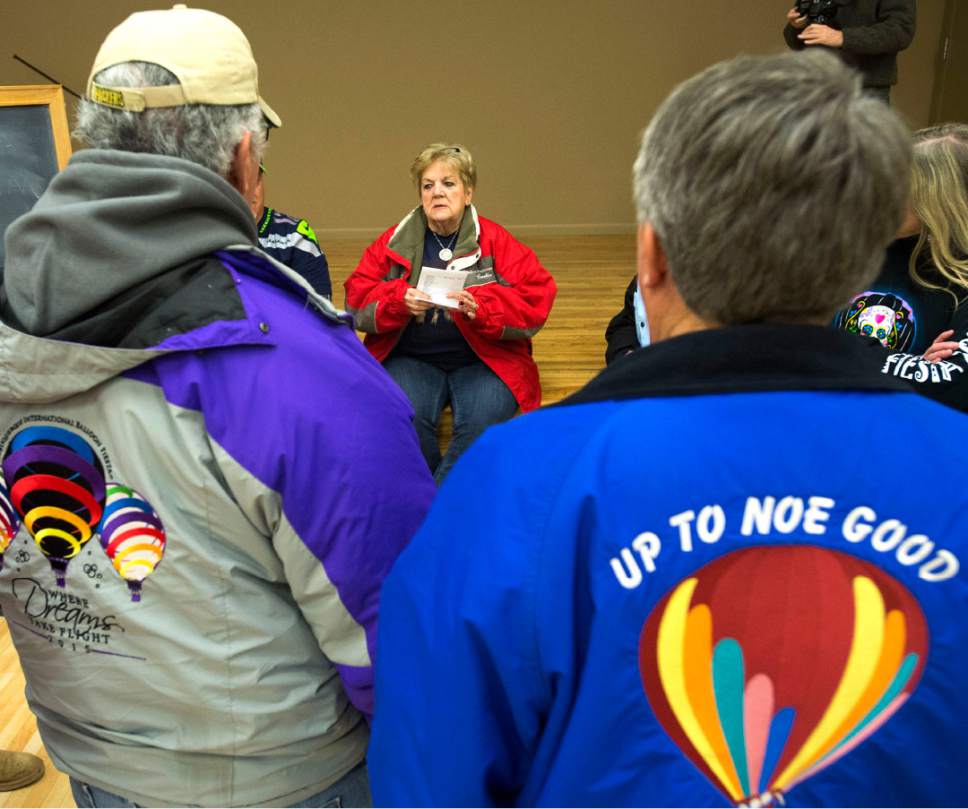 Rick Egan  |  The Salt Lake Tribune

Balloon Meister, Cookie May See, talks to the pilots about the weather, as they gather  for a briefing at the Bluf Community Center, during the Bluff Balloon Festival, Saturday, January 14, 2017.