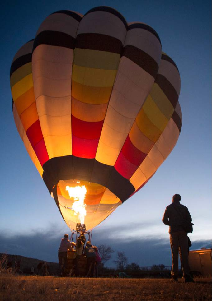 Rick Egan  |  The Salt Lake Tribune

A balloon is inflated at a dusk for the Glow-in during the Bluff Balloon Festival on Saturday, January 14, 2017.